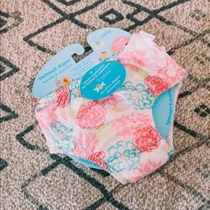 Reusable swim diaper with ruffle butt.
